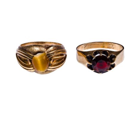 10k Yellow Gold and Gemstone Rings  (2) items including an oval cut cat eye and a round cut garnet; cat eye marked '10k' insi