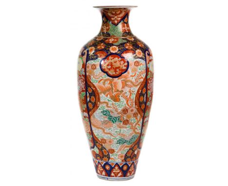 Japanese Floor Vase  Imari vase having blue, rust, white and cream floral motif with gold accents and bulbous shape  Property