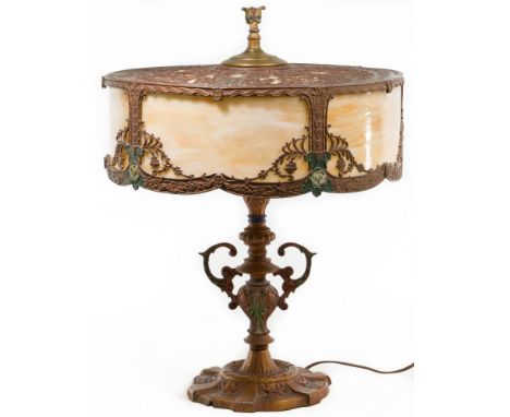 Art Nouveau Slag Glass Table Lamp  Having amber and white slag panels set in a floral and geometric themed frame, elevated on