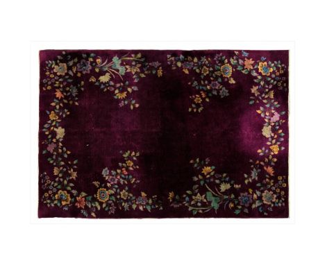 Chinese Art Deco Wool Room Size Rug  Handwoven having a floral motif in hues of gold, blue, green and yellow on a fuchsia fie