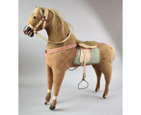 A Vintage Childs Toy Rocking Horse, Missing Stand and One Leg Requires Repair, with Saddle and Bridle, 70cms Long 