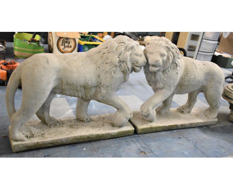 A Pair of Reconstituted Garden Figures, Lions with Paw Raised on Globe, Each 70cms Long 