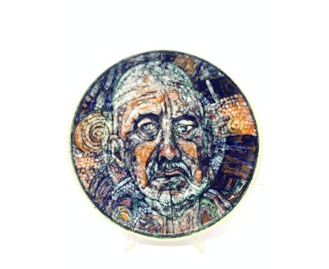 A Tony Morris home studio charger, thrown by Russel Sydenham decorated with an abstract self portrait of Tony in tones of blu