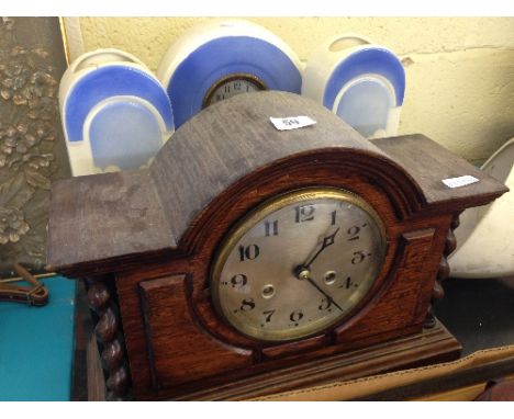 A French Art Deco ceramic clock garniture together with an oak cased Westminster Chime mantle clock with barley twist support