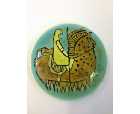A Poole Pottery Studio pin dish, Shape 49, decorated in colours with the image of a knight on horseback, TV backstamp.