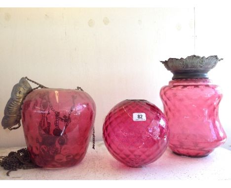 Three late 19th century Cranberry glass light shades.