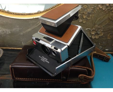 A Polaroid SX-70 land camera Alpha 1 in original leather case.