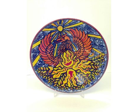 A Poole Pottery Living Glaze charger by Tony Morris, decorated with a spread eagle under yellow sunburst sun, printed marks t