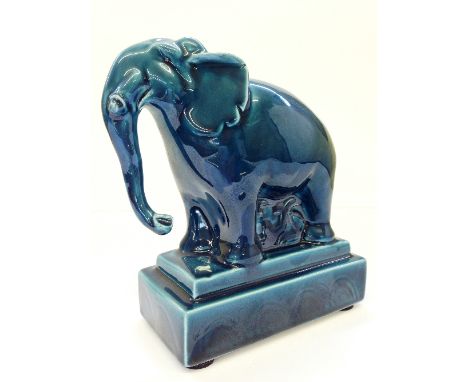 A Poole Pottery blue glazed model of an Elephant decorated by Nikki Massarella.