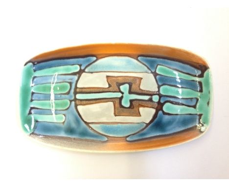 A Poole Pottery pin tray decorated in the style of Tony Morris with an abstract design in tones of blue, green, brown and ora