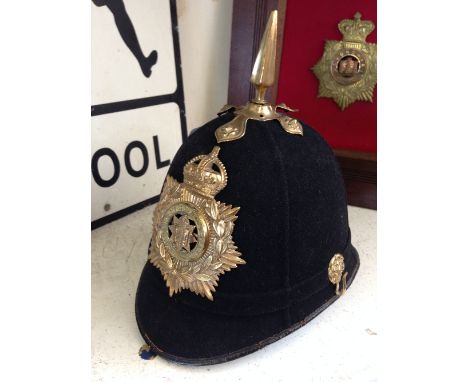 An early 20th century East Surrey Regiment 1 Policeman's helmet with original brass spike and badge (no chains).