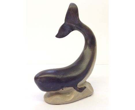 A Poole stoneware model of a Whale, similar in size to the blue glazed versions but produced by Alan White in the 1990's from