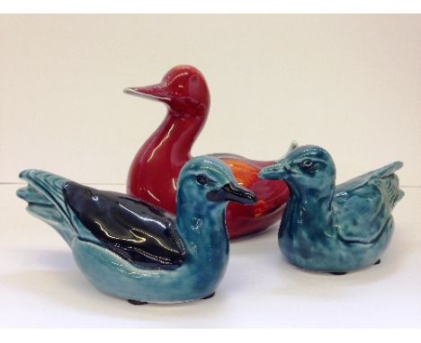 A Poole Pottery Living Glaze model of a Duck together with two blue glazed Seagulls.