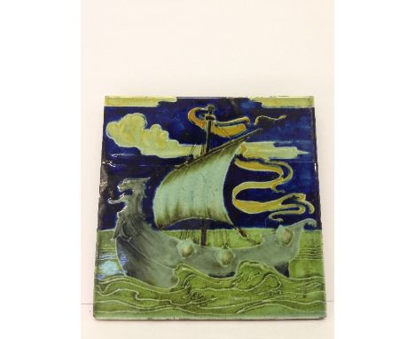 A rare Poole Pottery Carter's Tiles tile decorated in slip trailed faience with a galleon with single sail at sea in the mann