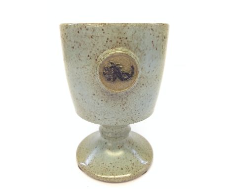 A Poole Pottery goblet by Guy Sydenham decorated with a raised dolphin seal, inscribed to base Poole, May 1976 with impressed