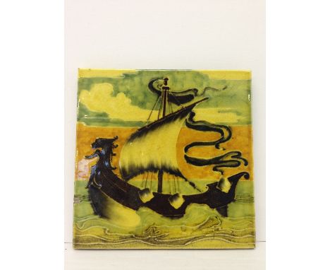  A rare Poole Pottery Carter's Tiles tile decorated in slip trailed faience with a galleon with single sail at sea in the man