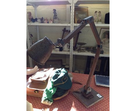 An early 20th century industrial metal angle poise lamp base by Memlite.