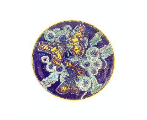 A Poole Pottery Living Glaze charger by Tony Morris, decorated with two large butterflies in tones of green, blue and orange.