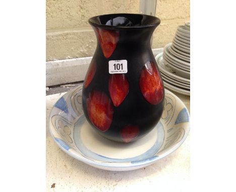 A Poole Pottery dish decorated in the Bellini pattern together with a Living Glaze Volcano vase.