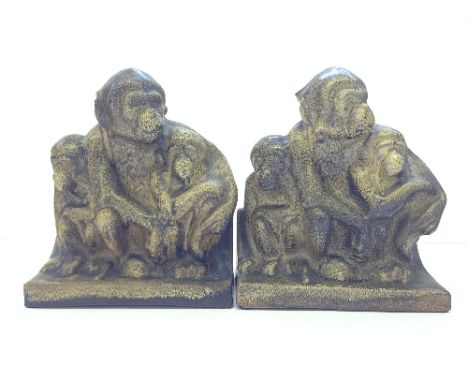 A pair of Poole Pottery Carter Stabler Adams brown glazed earthenware bookends modelled as Three Wise Monkeys after a design 