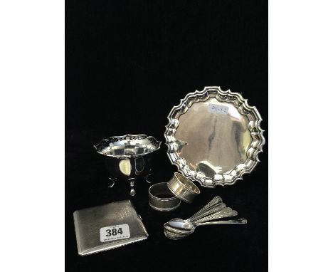 A small silver card tray together with six silver coffee spoons, two silver serviette rings, a silver sugar bowl and engine t