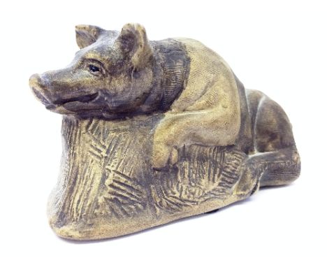 A Poole Pottery stoneware model of a Pig on straw, impressed marks to base and signed by the decorator June Cole.