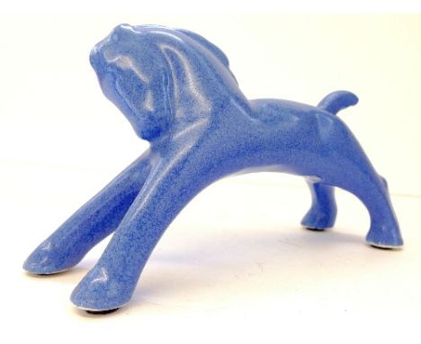 A Poole Pottery blue glazed model of a Rocking Horse, designed and modelled by John Adams, circa 1930.