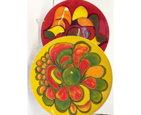 A Poole Pottery Delphis dish, shape 5, decorated in an abstract pattern on orange ground by Cynthia Bennett together with ano