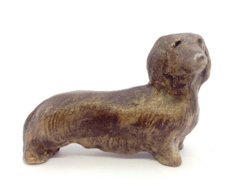 A Poole Pottery stoneware model of a Dachshund after a design by Bert Baggeley produced in the 1980's by Nicky Masserella.
