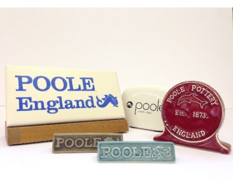 Five various Poole Pottery counter top advertising signs including two miniature Toblerone signs.