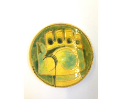 A Poole Pottery Studio pin dish, Shape 49, decorated in colours with the image of a fist, Mark No 46.