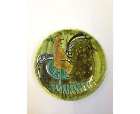 A Poole Pottery Studio pin dish, Shape 49, decorated in colours with the image of a knight on horseback, TV backstamp.