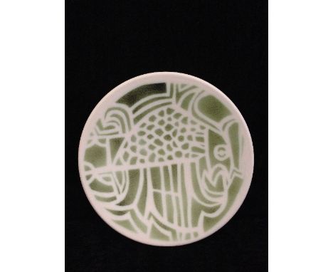 A Poole Pottery Studio pin dish, Shape 49, decorated in pale green tones on white ground with the image of a stylised bird, T