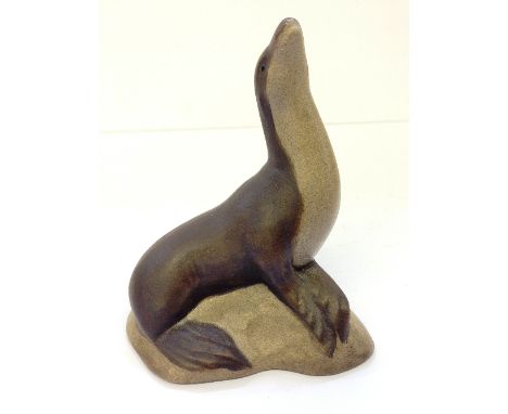 A Poole stoneware model of a Seal, originally modelled by Tony Morris in 1976 in blue glazed earthenware but reproduced by Al