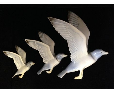 A graduated set of three Poole Pottery Flying Seagulls, designed and modelled by John Adams, assisted by Harry Brown, airbrus