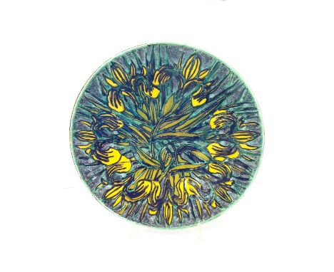 A Poole Pottery Living Glaze charger by Tony Morris, decorated with yellow irises in tones of yellow, green and blue.