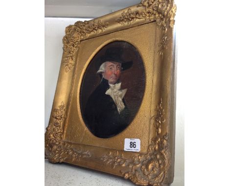 A gilt framed 19th century portrait oil on board: Gentleman in black hat and frock coat.