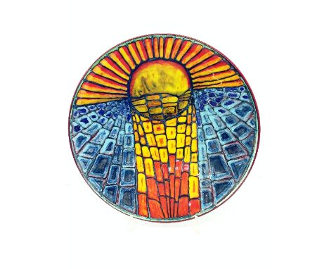 A Poole Pottery Living Glaze charger by Tony Morris, decorated in a Sunrise design in tones of orange, yellow and blue.