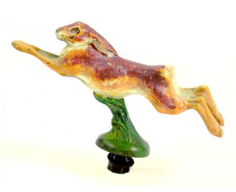 A COLD PAINTED BRONZE LEAPING HARE CAR RADIATOR OR OTHER MASCOT, 13.5CM L, CIRCA 1930