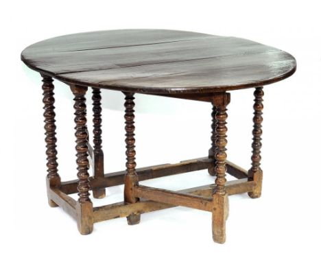A QUEEN ANNE OAK GATELEG TABLE ON BOBBIN TURNED UNDERFRAME, 118CM X 152CM, EARLY 18TH CENTURY