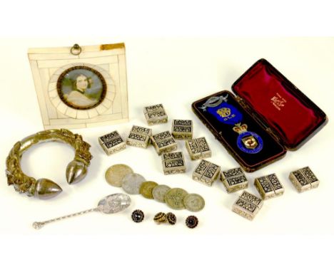 A SOUTH EAST ASIAN SILVER REPOUSSE BANGLE, A QUANTITY OF SILVER COLOURED METAL MINIATURE BOXES, AN RAOB SILVER AND ENAMEL JEW