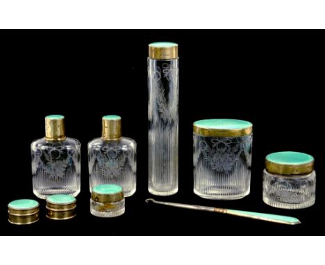 A PAIR OF GEORGE V SILVER GILT CYLINDRICAL BOXES WITH TURQUOISE GUILLOCHE ENAMEL COVERS AND SIX MATCHING SILVER GILT AND ENAM