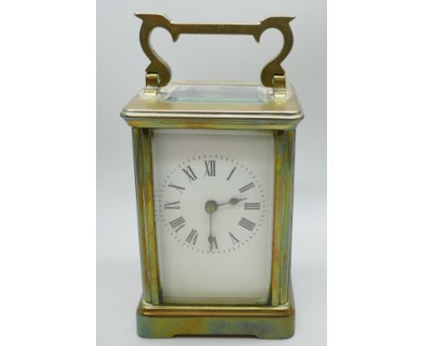 A brass framed four glass sided carriage clock, 11cm tall
