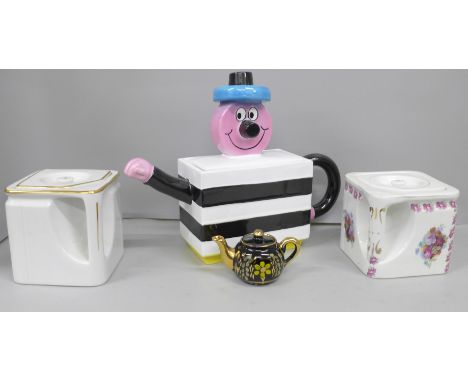 Two 'The Cube' teapots, one registered no 693783, a novelty 'Bertie Bassett' teapot and a miniature black and gilt teapot