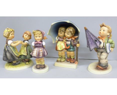 A collection of four boxed Goebel figures comprising of Is it Raining, Which Hand, Stormy Weather and Spring Dance