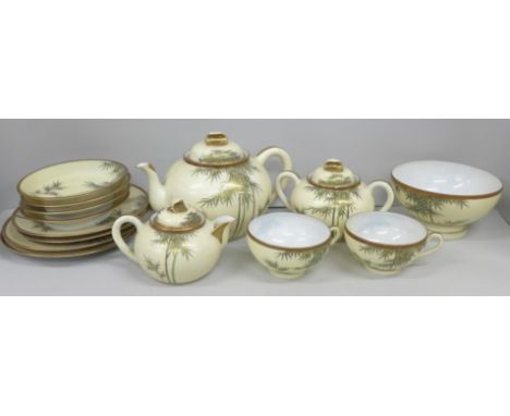 A Japanese eggshell porcelain tea set, with tea pot, cream and sugar, two cups, four saucers and tea plates and a bowl **PLEA