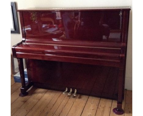 Boston (c2003) A Model UP126 upright piano in a bright mahogany case; together with a matching piano bench.