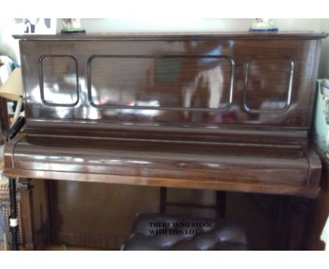 Steinway (c1924) A Model K upright piano in a panelled mahogany case.