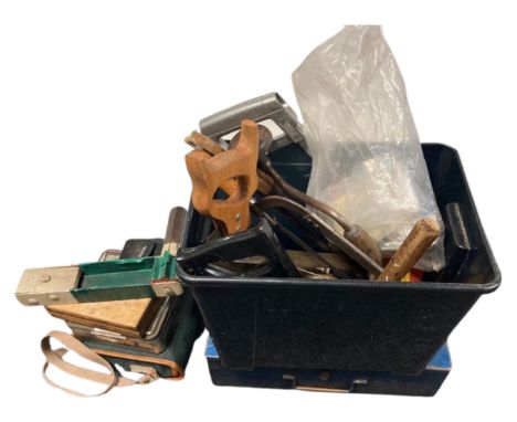 A quantity of tools, saws, a 'click-clack' machine etc.