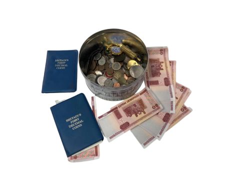 A tin containing coins, Russian banknotes etc. together with a brass lighter.